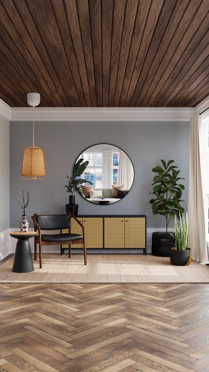 Un salon avec parquet et mur gris 